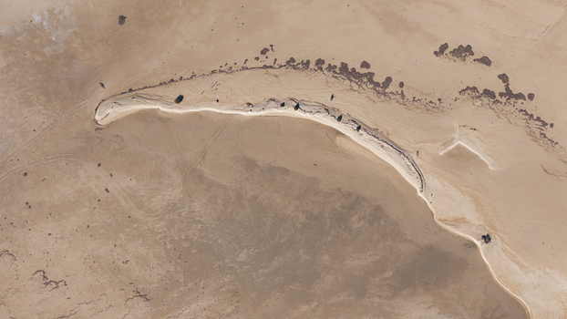 Aerial view of the intricate sand patterns and coastal landscape near the shoreline in Denham Western Australia Australia. Aerial view of the intricate sand patterns and coastal landscape near the shoreline in Denham Western Australia Australia.