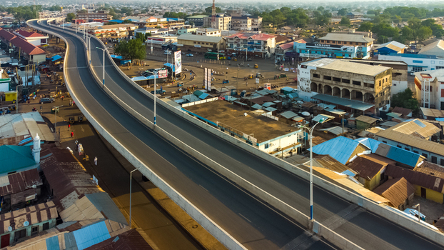 Tamale Ghana 16 March 2023 Aerial view of the Tamale Interchange winding through the urban landscape with surrounding buildings and rooftops.
