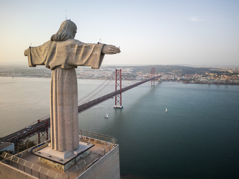 Aerial view of the Christ the King statue overlooking the Tagus River and the 25 de Abril Bridge in Lisbon Lisbon Portugal. Aerial view of the Christ the King statue overlooking the Tagus River and the 25 de Abril Bridge in Lisbon Lisbon Portugal.