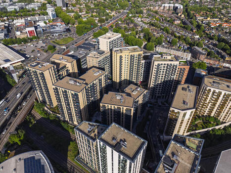 Aerial view of modern apartment buildings in Brentford featuring high rise residential blocks surrounding urban infrastructure and roads in Brentford England United Kingdom. Aerial view of modern apartment buildings in Brentford featuring high rise residential blocks surrounding urban infrastructure and roads in Brentford England United Kingdom.
