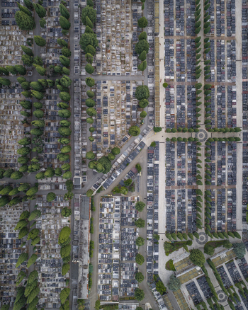 Aerial view of the structured layout of graves and cypress trees within a historic cemetery in Pula Istarska zupanija Croatia. Aerial view of the structured layout of graves and cypress trees within a historic cemetery in Pula Istarska zupanija Croatia.
