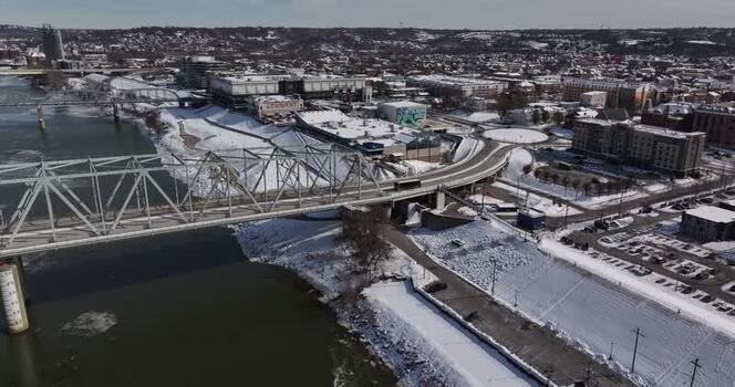 Aerial view of a steel bridge over a snowy river in Cincinnati United States. Aerial view of a steel bridge over a snowy river in Cincinnati United States.