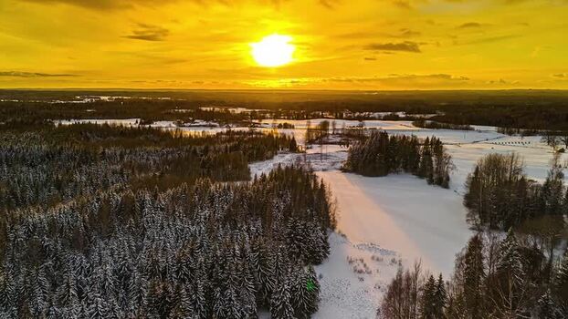 Aerial view of snowy forest and fields at sunset Latvia. Aerial view of snowy forest and fields at sunset Latvia.
