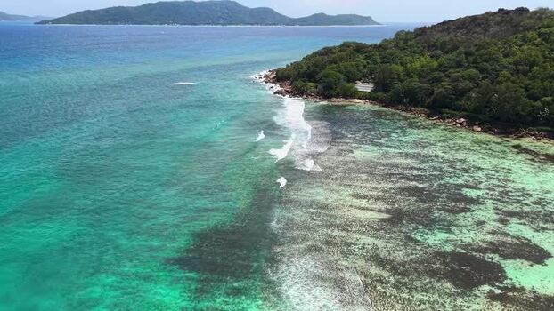 Aerial view of the tropical coastline and coral reefs Seychelles.