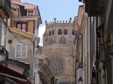 View of the historic Catedral de Ourense framed by traditional stone buildings and narrow streets in the city center Ourense Ourense Spain. View of the historic Catedral de Ourense framed by traditional stone buildings and narrow streets in the city center Ourense Ourense Spain.