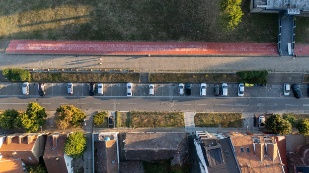 Aerial view of a parking lot along a red walkway in Sremska Mitrovica Vojvodina Serbia. Aerial view of a parking lot along a red walkway in Sremska Mitrovica Vojvodina Serbia.