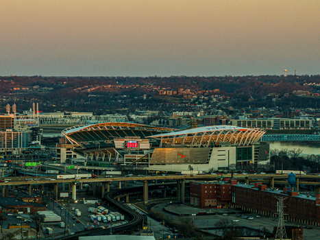 Aerial view of the Paul Brown Stadium and its surrounding highway system bathed in the warm glow of the setting sun Cincinnati United States. Aerial view of the Paul Brown Stadium and its surrounding highway system bathed in the warm glow of the setting sun Cincinnati United States.