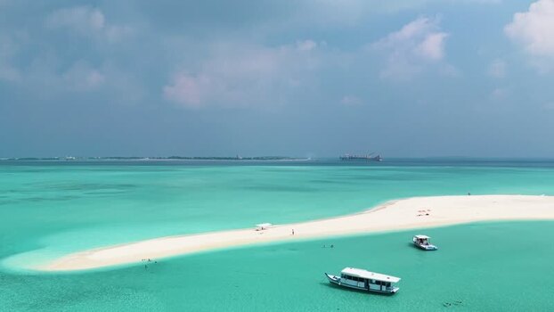 Aerial view of a white sandbar surrounded by turquoise ocean water Maldives. Aerial view of a white sandbar surrounded by turquoise ocean water Maldives.