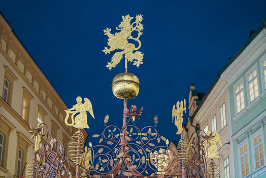 Prague Prague Czechia 03 November 2021 View of the golden lion sculpture atop the historic Marian Column in Old Town Square featuring intricate metalwork against a twilight sky. Prague Prague Czechia 03 November 2021 View of the golden lion sculpture atop the historic Marian Column in Old Town Square featuring intricate metalwork against a twilight sky.
