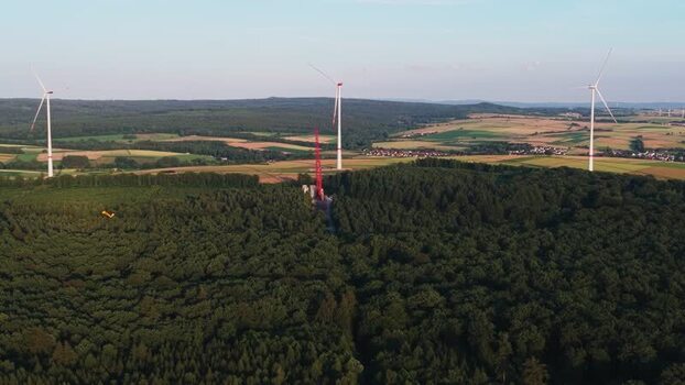 Aerial view of wind turbines in a forest near Hofgeismar Germany. Aerial view of wind turbines in a forest near Hofgeismar Germany.
