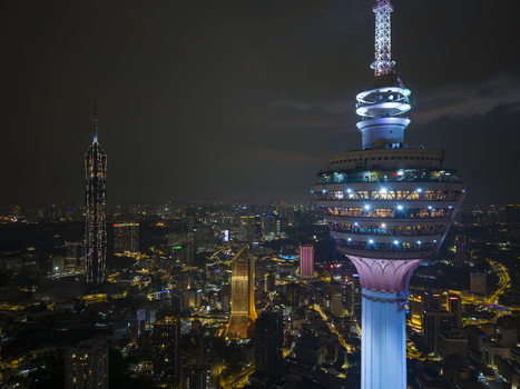 Kuala Lumpur Malaysia 11 March 2026 Aerial view of the illuminated KL Tower and Merdeka 118 skyscraper against the night city skyline.