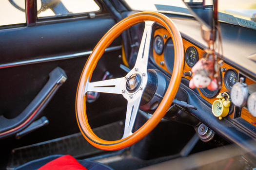 View of a vintage car s interior with a wooden steering wheel chrome accents and classic gauges evokes a sense of nostalgia Pula Istria County Croatia.