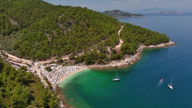 Aerial view of a beach with boats in Thasos Greece. Aerial view of a beach with boats in Thasos Greece.