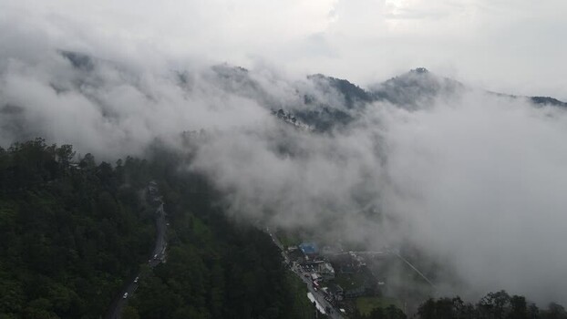 Aerial view of misty mountain road in Tawangmangu Indonesia. Aerial view of misty mountain road in Tawangmangu Indonesia.