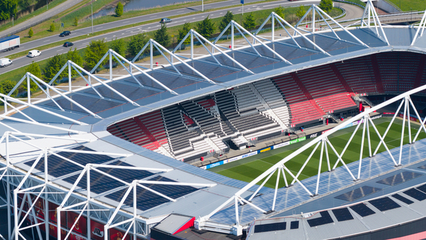 Alkmaar Netherlands 05 May 2026 Aerial view of AFAS stadium featuring its distinctive white truss roof structure with solar panels and red and white seating.