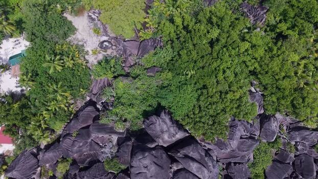 Aerial view of Anse Reunion granite boulders Seychelles.