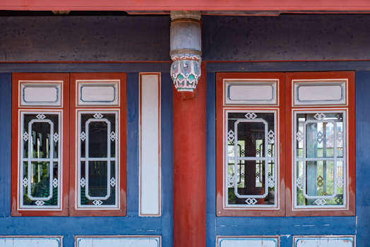 View of the intricate traditional wooden window frames and decorative pillar of Chihkan Tower in Chihkan Village Tainan City Taiwan. View of the intricate traditional wooden window frames and decorative pillar of Chihkan Tower in Chihkan Village Tainan City Taiwan.