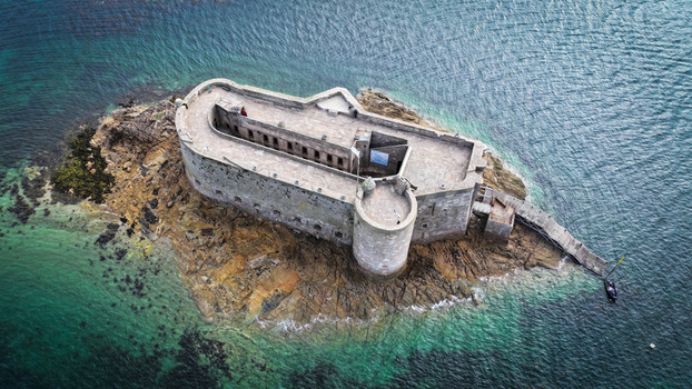 Aerial view of the imposing Fort du Taureau stands resolute against the turquoise waters a testament to history and nature s embrace Plouezoc h Bretagne France. Aerial view of the imposing Fort du Taureau stands resolute against the turquoise waters a testament to history and nature s embrace Plouezoc h Bretagne France.