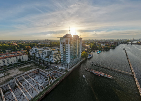 Aerial view of the Treptowers office complex situated along the Spree river during a golden sunset in Berlin Berlin Germany. Aerial view of the Treptowers office complex situated along the Spree river during a golden sunset in Berlin Berlin Germany.
