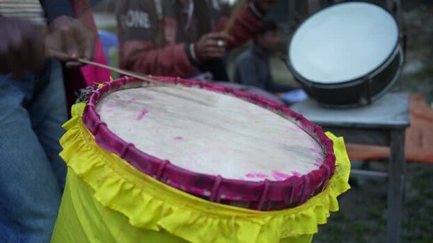 View of a musician playing a traditional drum in Bogura Bangladesh. View of a musician playing a traditional drum in Bogura Bangladesh.
