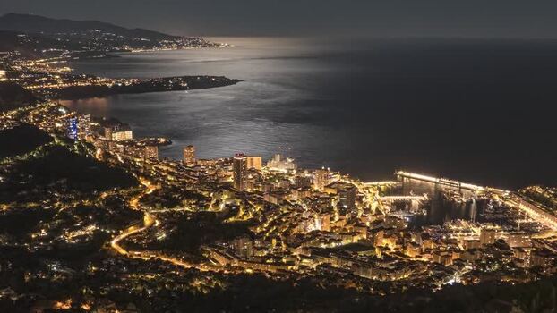 Aerial view of Monaco city lights at night Monaco.