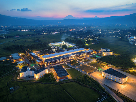 Aerial view of Benteng Fort Willem I illuminated at twilight surrounded by lush rice fields and distant mountains in Ambarawa Central Java Indonesia. Aerial view of Benteng Fort Willem I illuminated at twilight surrounded by lush rice fields and distant mountains in Ambarawa Central Java Indonesia.