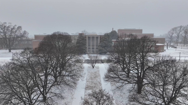 Aerial view of a school building surrounded by snow covered trees and grounds in Lynchburg Virginia United States.