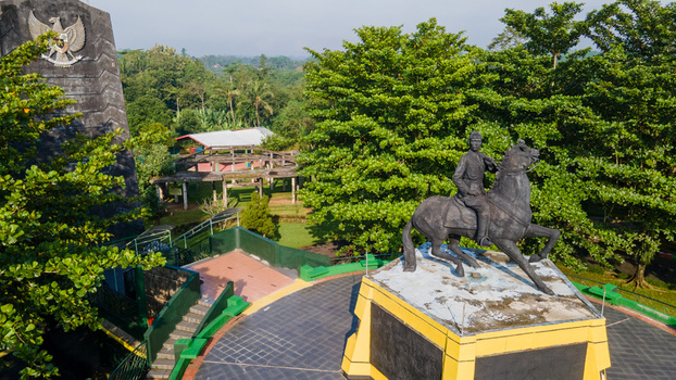 Purwokerto Indonesia 08 May 2026 Aerial view of the National Monument of Jendral Soedirman featuring the general on horseback and the Garuda Pancasila emblem among lush trees. Purwokerto Indonesia 08 May 2026 Aerial view of the National Monument of Jendral Soedirman featuring the general on horseback and the Garuda Pancasila emblem among lush trees.