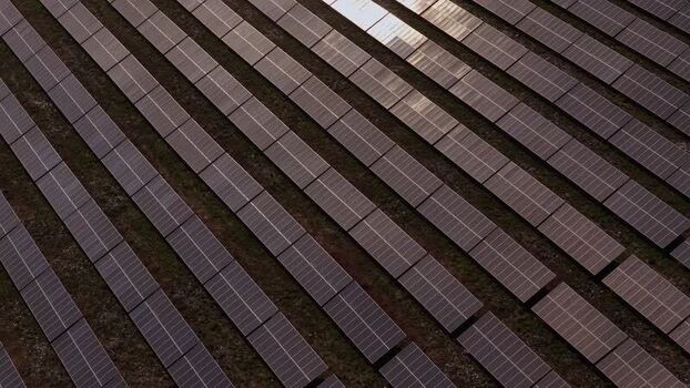 Aerial view of solar panels in a photovoltaic power plant Portugal. Aerial view of solar panels in a photovoltaic power plant Portugal.