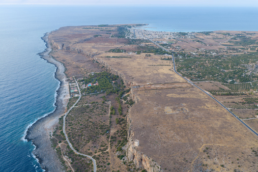 Aerial view of the rugged coastline and cliffs of Riserva Naturale Orientata dello Zingaro near the town of San Vito Lo Capo Sicilia Italy. Aerial view of the rugged coastline and cliffs of Riserva Naturale Orientata dello Zingaro near the town of San Vito Lo Capo Sicilia Italy.