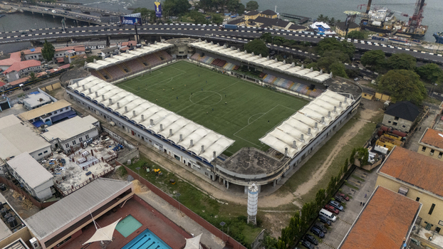 Aerial view of the Mobolaji Johnson Arena stadium with its green pitch and seating area surrounded by urban infrastructure and roads in Lagos Lagos Nigeria. Aerial view of the Mobolaji Johnson Arena stadium with its green pitch and seating area surrounded by urban infrastructure and roads in Lagos Lagos Nigeria.