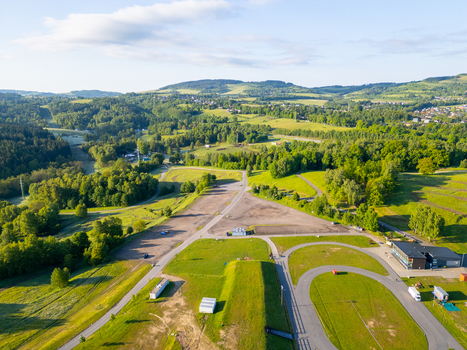 Aerial view of the Cross country ski area Vesec featuring paved tracks grassy hills and surrounding forests in Liberec Liberec Region Czechia. Aerial view of the Cross country ski area Vesec featuring paved tracks grassy hills and surrounding forests in Liberec Liberec Region Czechia.