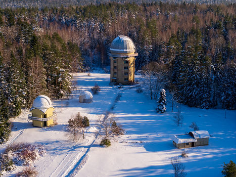 Aerial view of the Moletai Astronomical Observatory with telescope domes in a snow covered forest clearing in Kulionys Utenos apskritis Lithuania. Aerial view of the Moletai Astronomical Observatory with telescope domes in a snow covered forest clearing in Kulionys Utenos apskritis Lithuania.