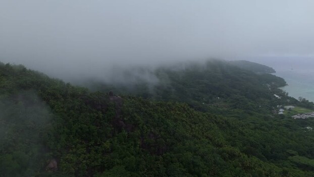 Aerial view of lush green mountains on Mahe island Seychelles.