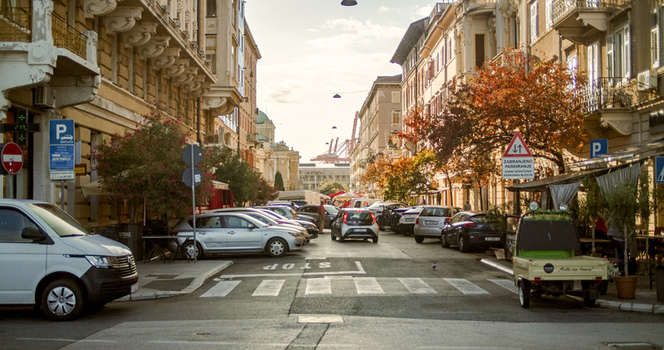 Rijeka Croatia 19 September 2026 View of a busy street in Rijeka with parked cars historic architecture and autumn foliage under a soft afternoon light. Rijeka Croatia 19 September 2026 View of a busy street in Rijeka with parked cars historic architecture and autumn foliage under a soft afternoon light.