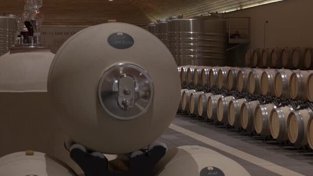 View of Cru Class&eacute; de Graves winery with barrels France.
