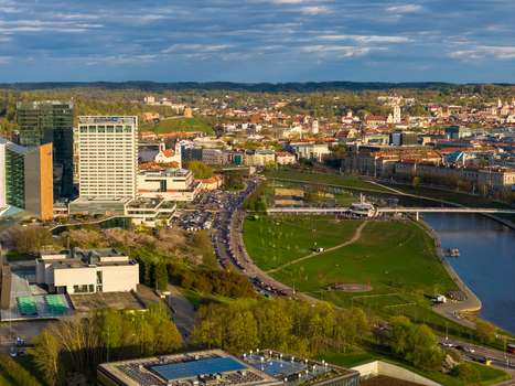 Vilnius Lithuania 01 May 2026 Aerial view of the city skyline featuring modern skyscrapers the Neris River and the historic old town under a soft evening light. Vilnius Lithuania 01 May 2026 Aerial view of the city skyline featuring modern skyscrapers the Neris River and the historic old town under a soft evening light.