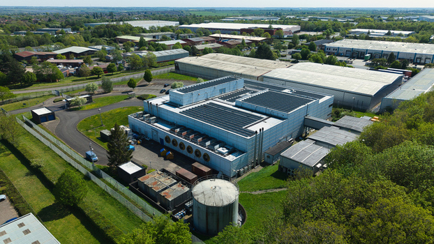 Aerial view of the Data Centre with solar panels on the roof and cooling systems in an industrial park in Wellingborough England United Kingdom. Aerial view of the Data Centre with solar panels on the roof and cooling systems in an industrial park in Wellingborough England United Kingdom.