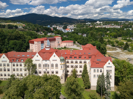 Aerial view of the Faculty of Economics at Matej Bel University with its distinctive red roof and surrounding greenery in Banska Bystrica Banskobystricky kraj Slovakia. Aerial view of the Faculty of Economics at Matej Bel University with its distinctive red roof and surrounding greenery in Banska Bystrica Banskobystricky kraj Slovakia.