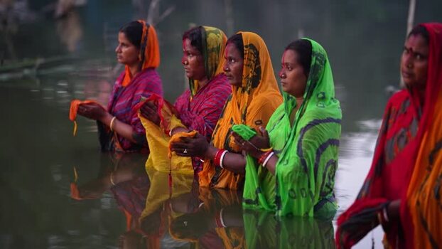 View of women performing a religious ritual in the water Bangladesh. View of women performing a religious ritual in the water Bangladesh.