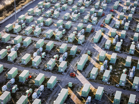 Trino Italy 30 March 2026 Aerial view of a sea of pale green containers neatly arranged in rows casting long shadows on the dusty ground. Trino Italy 30 March 2026 Aerial view of a sea of pale green containers neatly arranged in rows casting long shadows on the dusty ground.
