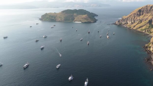 Aerial view of Padar Island with boats in the bay Indonesia.