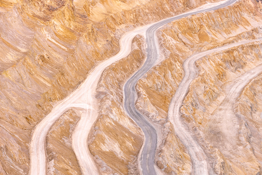 Geamana Romania 21 September 2026 Aerial view of the Geamana mining site featuring winding dirt roads carved into steep terraced slopes of the industrial landscape. Geamana Romania 21 September 2026 Aerial view of the Geamana mining site featuring winding dirt roads carved into steep terraced slopes of the industrial landscape.