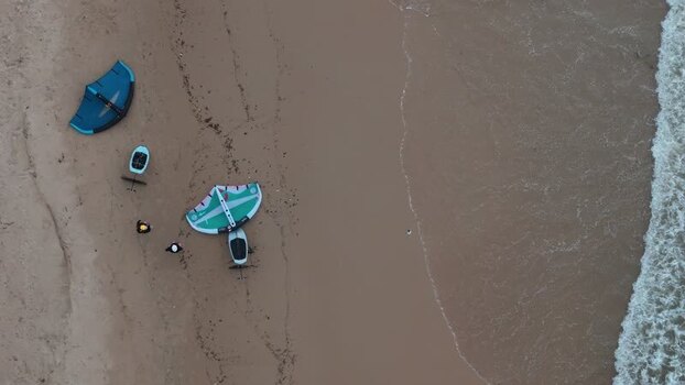 Aerial view of wing foilers on the sandy beach Portugal. Aerial view of wing foilers on the sandy beach Portugal.
