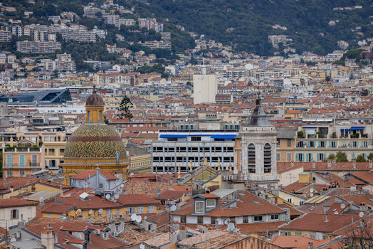 Aerial view of historic rooftops in Nice featuring the dome of the Chapelle de la Misericorde and the bell tower of the Cathedrale Sainte Reparate in Nice Provence Alpes Cote d Azur France. Aerial view of historic rooftops in Nice featuring the dome of the Chapelle de la Misericorde and the bell tower of the Cathedrale Sainte Reparate in Nice Provence Alpes Cote d Azur France.
