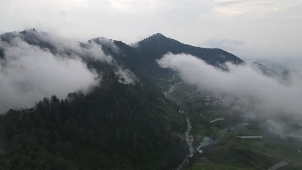 Aerial view of misty mountains and green hills Indonesia. Aerial view of misty mountains and green hills Indonesia.