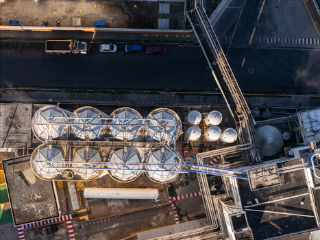 Aerial view of the beer industrial complex with large storage tanks industrial piping and infrastructure in Santo Domingo Dominican Republic. Aerial view of the beer industrial complex with large storage tanks industrial piping and infrastructure in Santo Domingo Dominican Republic.