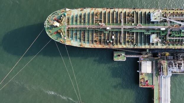 Aerial view of tanker ship at industrial terminal in Indonesia. Aerial view of tanker ship at industrial terminal in Indonesia.