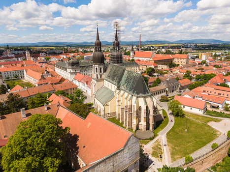 Aerial view of St. Nicholas Basilica with its iconic twin towers and the historic red tiled rooftops of the old town under a cloudy sky in Trnava Trnava Region Slovakia. Aerial view of St. Nicholas Basilica with its iconic twin towers and the historic red tiled rooftops of the old town under a cloudy sky in Trnava Trnava Region Slovakia.