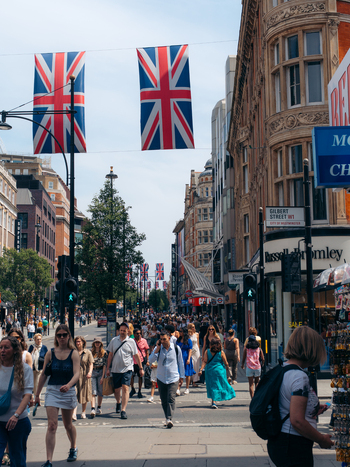 London United Kingdom 20 June 2025 View of Oxford Street bustling with shoppers beneath the vibrant Union Jack flags a lively scene of urban energy. London United Kingdom 20 June 2025 View of Oxford Street bustling with shoppers beneath the vibrant Union Jack flags a lively scene of urban energy.